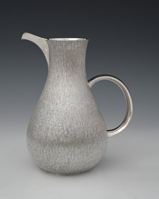 Lot 475 - Christopher Lawrence, a silver water jug, the...