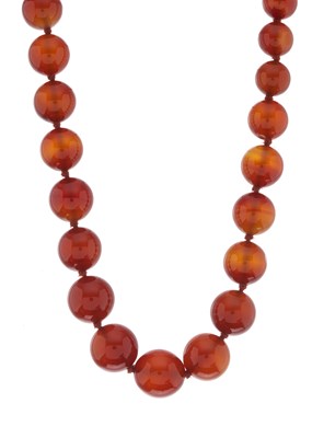 Lot 172 - A graduated carnelian bead necklace, with 14ct...