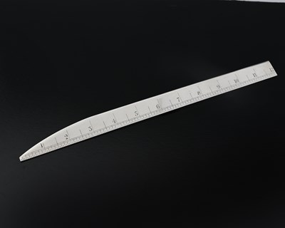 Lot 228 - A George V silver combination ruler and letter...