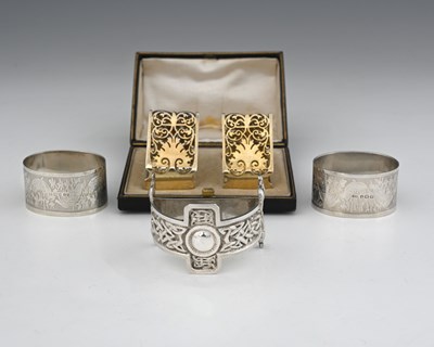 Lot 273 - A cased pair of Victorian silver-gilt napkin...