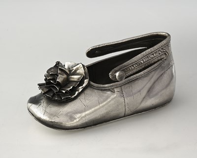 Lot 449 - A George V silver novelty shoe, formed as a...
