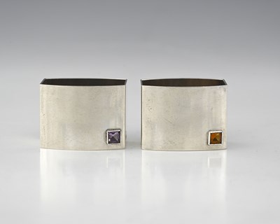 Lot 556 - Helen West, a pair of cubist silver napkin...
