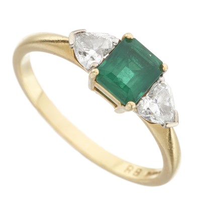 Lot 59 - An 18ct gold emerald and diamond three-stone ring