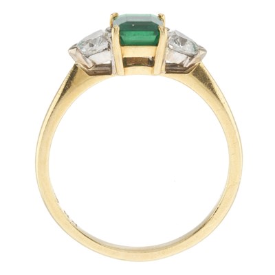 Lot 59 - An 18ct gold emerald and diamond three-stone ring