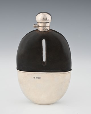 Lot 256 - A George V silver and leather-mounted glass...