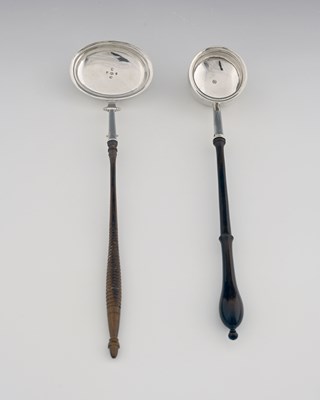 Lot 24 - A punch ladle with a turned wood handle, the...
