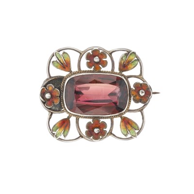 Lot 3 - An Art Nouveau silver purple orange tourmaline and enamel floral brooch