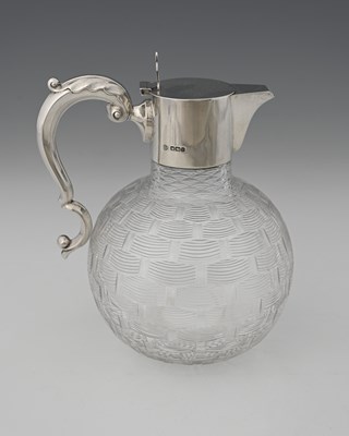 Lot 502 - A George V silver-mounted claret jug, the...
