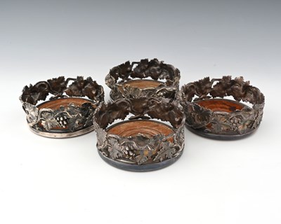 Lot 723 - Four Victorian plated naturalistic bottle...