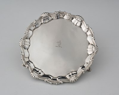 Lot 305 - A George II silver waiter, supported on three...