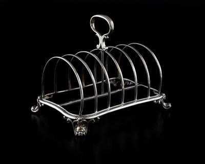 Lot 324 - A Victorian silver seven-bar toast rack, atop...
