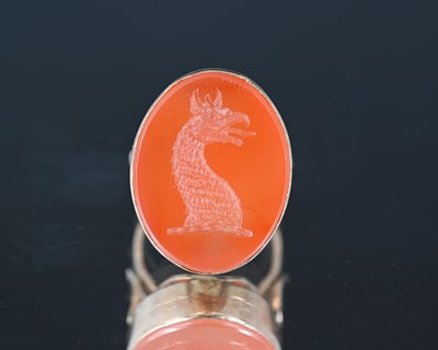 Lot 25 - A gold-coloured metal mounted carnelian seal,...