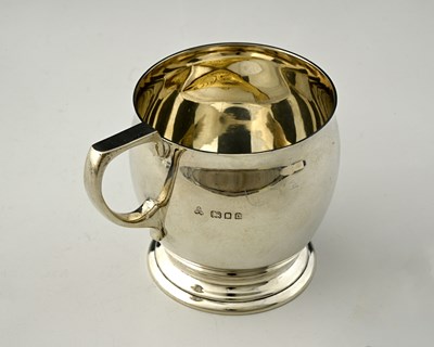 Lot 527 - An Art Deco style silver mug, the inside of...