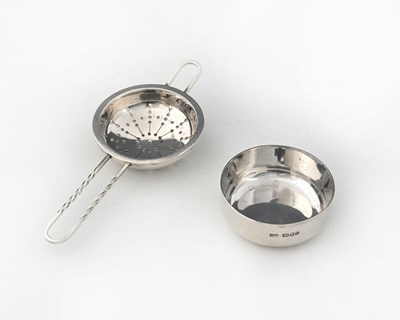Lot 160 - Robert Welch, a silver tea strainer on stand,...