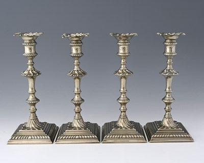Lot 598 - Four eighteenth-century Paktong candlesticks,...