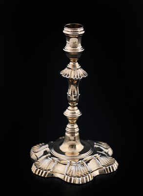 Lot 321 - A George II silver-gilt cast taperstick,...