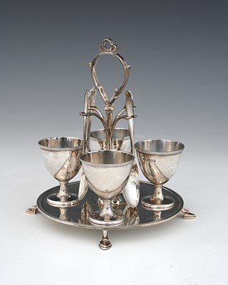 Lot 123 - A George V silver egg cruet, with four egg...