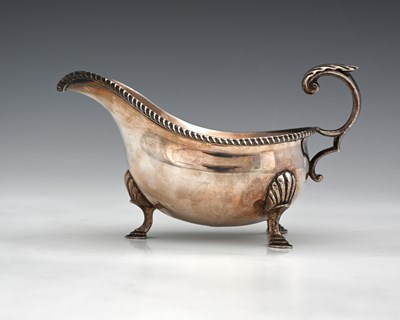 Lot 104 - An Edward VIII silver sauce boat, with...