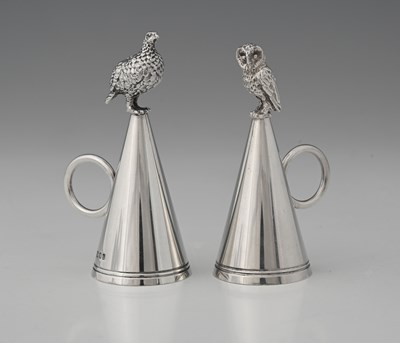 Lot 542 - Brian Leslie Fuller, two silver conical candle...