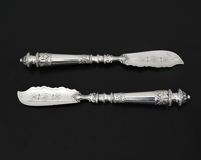 Lot 75 - A pair of Victorian silver butter knives, the...