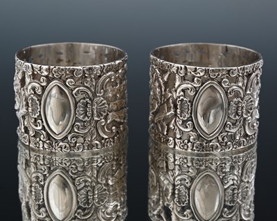 Lot 79 - A pair of Victorian cast silver napkin rings,...