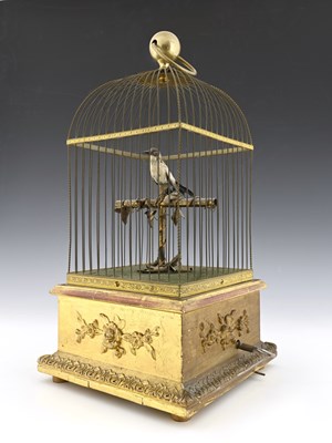 Lot 232 - A clockwork Automaton singing bird in a cage,...