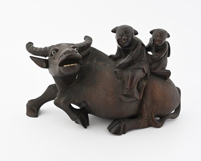Lot 378 - A Chinese hardwood carving of two boys on a...