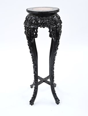 Lot 385 - A Chinese hardwood jardiniere stand, late Qing...