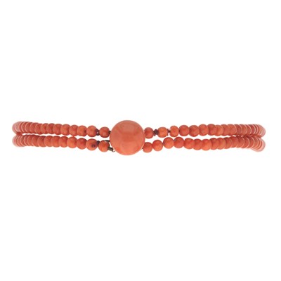 Lot 202 - An early 20th century coral two-row choker necklace, with yellow metal clasp