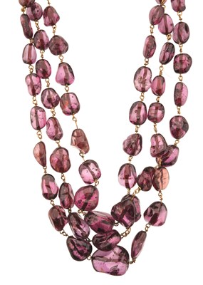 Lot 109 - A pink topaz bead three-row necklace, with gold clasp, at fault