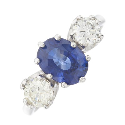 Lot 148 - A platinum sapphire and diamond three-stone ring