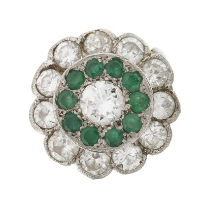 Lot 101 - A mid 20th century 18ct gold and platinum, diamond and emerald cluster ring