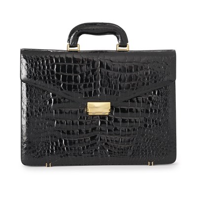 Lot 476 - A vintage black glossy crocodile briefcase.