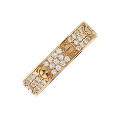 Lot 142 - Cartier, an 18ct rose gold pave-set diamond Love band ring