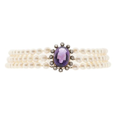 Lot 178 - A pearl three-row choker necklace, with 19th century amethyst and diamond cluster clasp