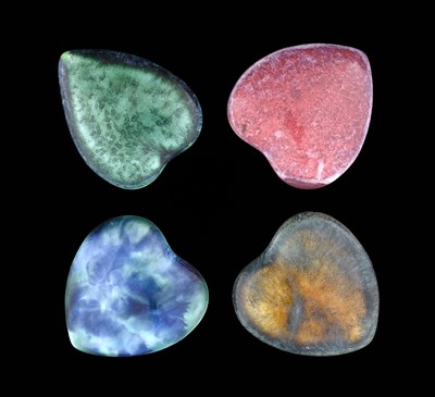 Lot 611 - Ruskin Pottery, four Souffle glazed heart form...