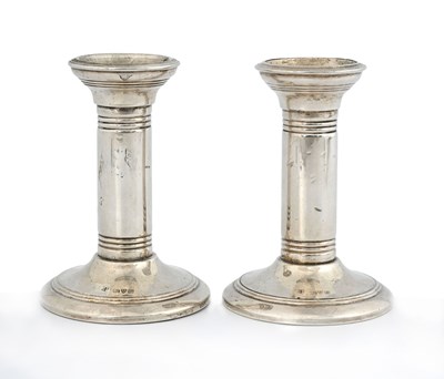 Lot 75 - A pair of Edwardian silver candlesticks, each...