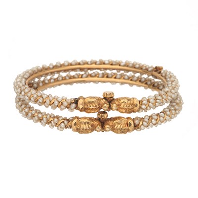 Lot 38 - Two gold pearl zoomorphic hinged bangle bracelets