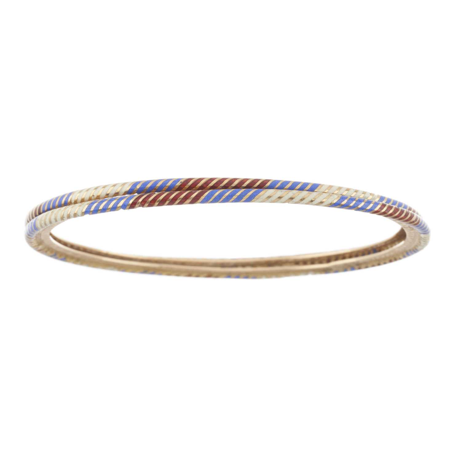Lot 28 - Two early 20th century gold vari-hue enamel bangle bracelets