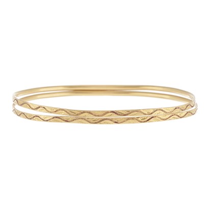 Lot 155 - Two early 20th century gold bangle bracelets