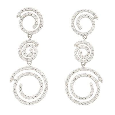 Lot 56 - A pair of 18ct gold diamond swirl drop earrings