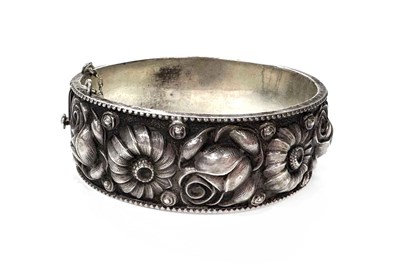 Lot 2 - An early to mid 20th century silver floral bangle bracelet
