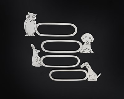 Lot 551 - A set of four novelty silver napkin rings,...