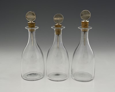Lot 515 - A set of three Art Deco silver-topped glass...