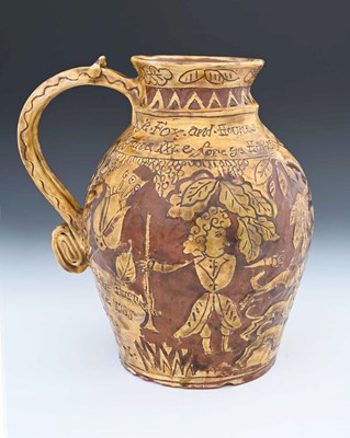 Lot 673 - An English slipware jug, sgraffito decorated...
