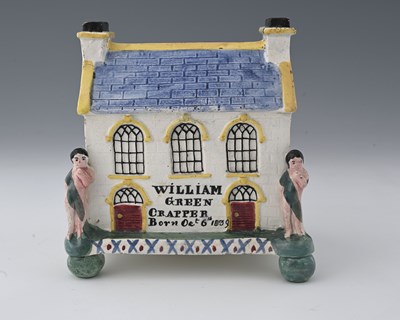 Lot 672 - A Mexborough Prattware Pottery money box,...
