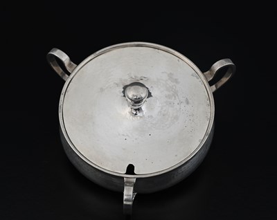 Lot 87 - A E Jones, an Arts and Crafts silver three...