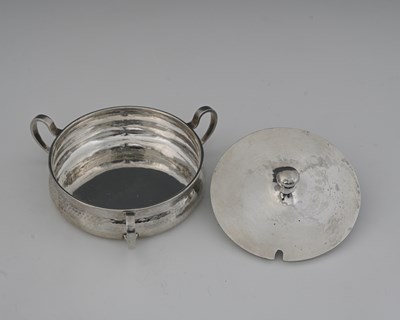 Lot 87 - A E Jones, an Arts and Crafts silver three...