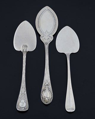 Lot 20 - Three Victorian silver butter spades, the stem...