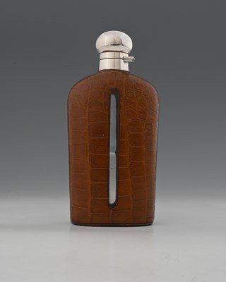 Lot 726 - Hamilton & Inches, a leather-covered glass hip...